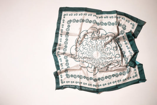 Decorative scarf with a central mandala design on a white background